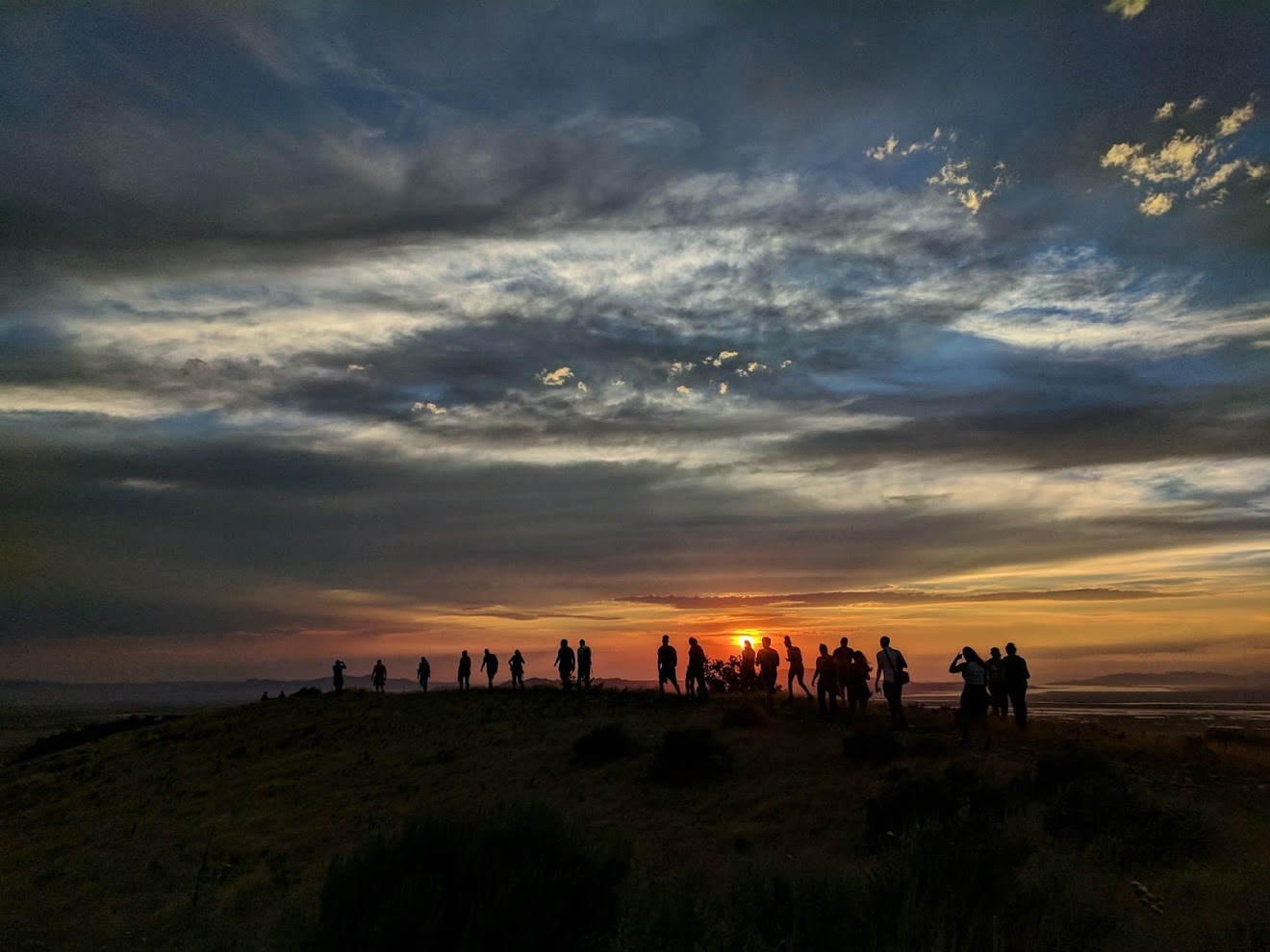 WR Trail top silhouette hikers